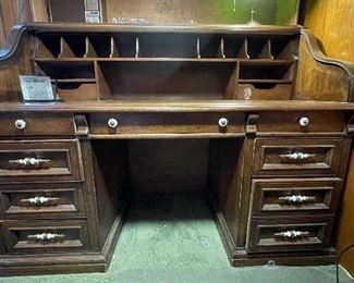 Vintage Roll Top Desk. Measures 57" W x 28" D x 44" H. Photo Great As Is But WOW, Wouldn't This Be Cool Painted or Lacquered? Ask Us About Details! 1 of 2.