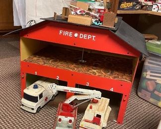 Vintage Fire Department Toy House with Trucks.