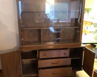 MCM China Cabinet has 2 Shelves on each side of the 3 center drawers.