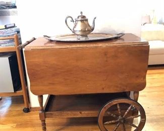 Drop Leaf Tea Cart (33in W x 18in D , 28.3/4in Tall as seen with leaves dropped.)  Each Leaf is 12.3/4in  wide. Silverplate Tea Kettle and Tray on top.