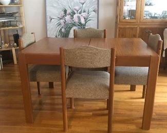 MCM Style Dining Table and 4 Chairs. Dining Table has leaf storage built in.