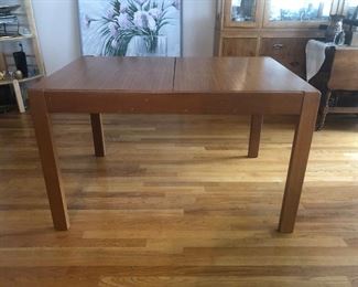 MCM table shown with leaf stored. Table in this configuration measures 33in W x 48in L x 30in H.