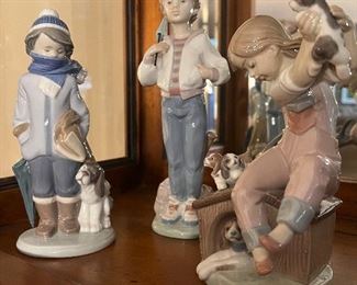 Lladro:  (L-R) Winter Boy w/scarf; All American Boy; Pick of the Litter