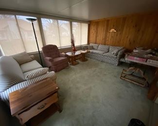 Couch with full size pull out bed, recliner, couch, coffee table and end tables. 