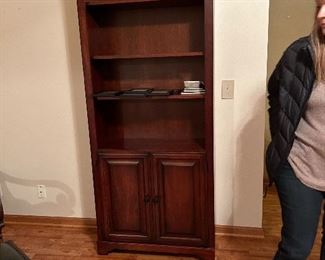 book shelf w/ two doors on the bottom