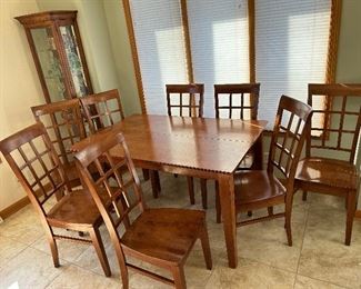An excellent condition kitchen/dinning room table and has a wide table leaf (not shown). 8 - "window framed" style back sturdy chairs.
