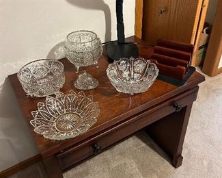 elegant glass bowls... sitting on a computer desk (or can be used as a regular writing desk.)