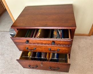 A two drawer wood filing unit.