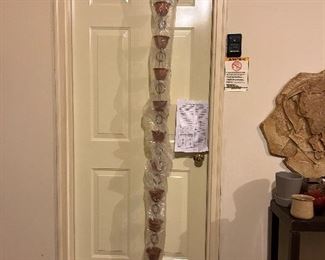 this is a copper RAIN CHAIN about 8' tall in it's original plastic sleeve.