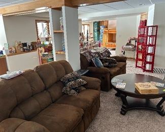 2 double recliners, couch pillows, a cool round cocktail table, note the red photo organizer upper right.