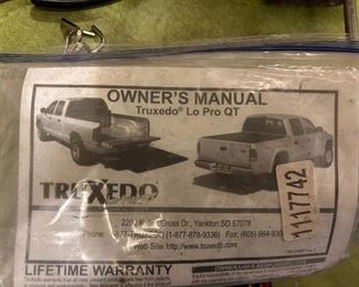 TruXedo Premiere soft rollup Tonneau Cover with owner’s manual and hardware to attach to your vehicle.