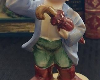 Left on “April” showers figurine