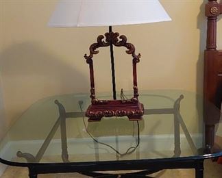 Glass top coffee table wrought iron base