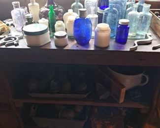 Many old insulators and bottles