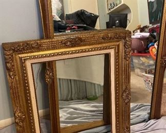 Framed Mirror And Empty Frame