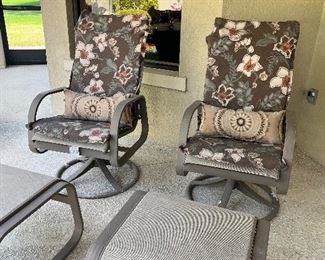 Two outdoor patio chairs with ottoman