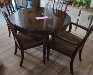 44" round dining table.  Includes two 18" leaves and 6 chairs