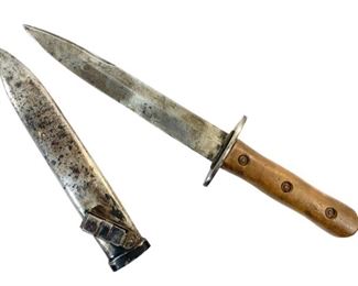 WWII Nazi Germany Wehrmacht Luftwaffe Style Combat Knife - The knife appears appears to be a Luftwaffe combat/boot knife from World War II but has a few differences: the blade is not marked, the handle uses a different kind of rivets than usual, the handle is shaped slightly different, and the sheath is a abnormal as well. It is possible the knife is an earlier version but it is unknown if the knife is authentic and it could be a reproduction. The blade is 8in long and the knife is 13.5in long overal