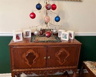 Early 1900's dining table, 6 chairs, sideboard, server, and china cabinet.  Christmas ornaments by Royal Doulton and the city of Conyers.
