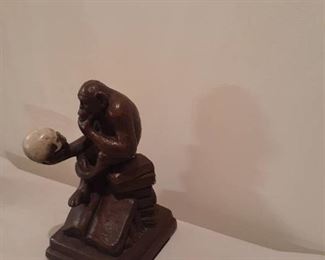 Bronze 9.5 inch monkey holding human skull statue. See pictures for artist