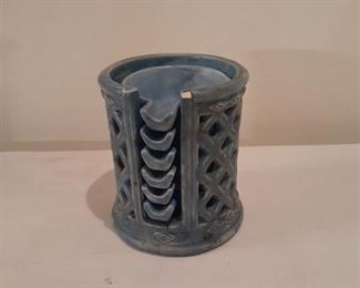 (6) short ceramic ashtrays with holder. Has small chip