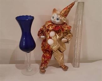 Blue wine glass with ceramic cat in clown costume. Approximately 13 in tall (to tip of hat). Cat is also musical