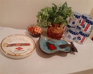 Ashtrays plus bar glasses and monkey planter with faux plant. Handle on guitar has been repaired.