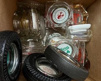hundreds of old advertising ashtrays