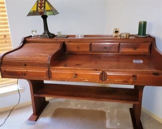 Teak writing desk with partial roll top.  Retro-look parlor lamp