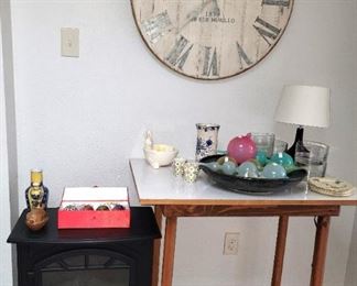 Antique-look room heater, wood table, glass ornaments (clock SOLD)