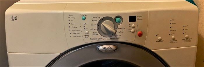 LIKE NEW WHIRLPOOL FRONT LOADER WASHER AND DRYER WITH PEDESTALS.