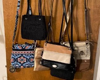 JUST A HANDFUL OF ALL THE PURSES WE HAVE.