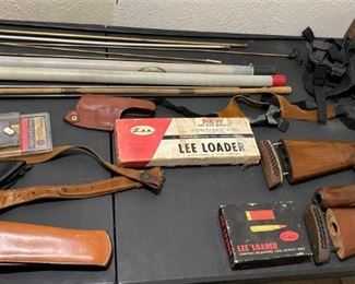 LOTS OF HOLSTERS AMMO AND MAGAZINES AND MORE.