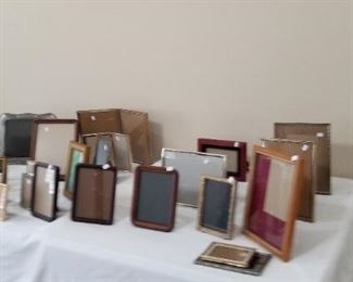 Large assortment of table top picture frames