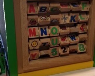 This is a large wooden station which includes several different games and toys.  A great find for your child or grandchild.