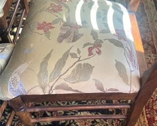 Fabric upholstery on each seat