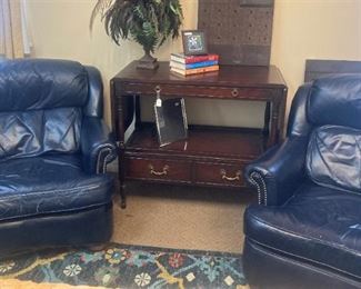 Blue leather club chairs (Each has a matching ottoman.)