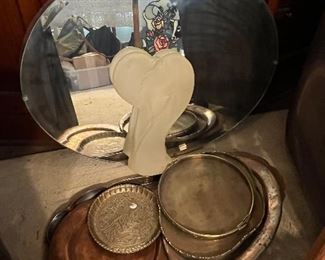 Oval mirror and brass treasures