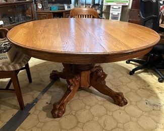 Gorgeous wood carved round dining table; includes 2 leaves!