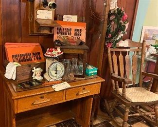 Desk, lady head, rocker, wall phone, coat rack, milk bottles, scale, disease signs
