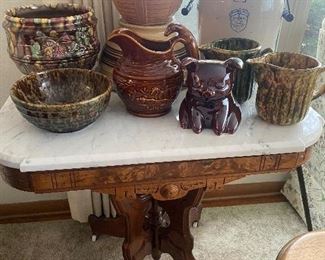 Eastlake marble top table, stoneware, 2 gallon butter churn, piggy bank, pitchers stoneware 