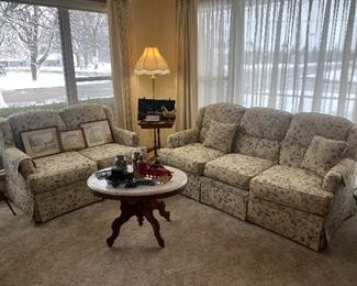Floral couch and loveseat, floor lamp, side table