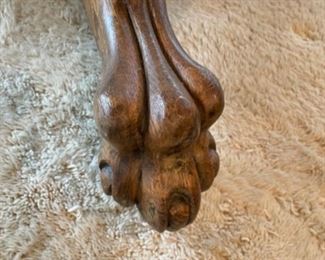 DETAILS OF CLAW FEET ON OAK TABLE