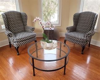 Pair of wingback chairs. 38" x 44".  Pottery Barn hammered iron 36" coffee table