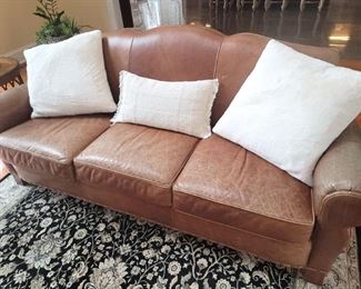 Ethan Allen distressed leather sofa and ottoman. 87"w x 32"d x 36"h