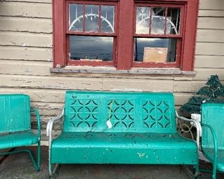 2 Gliders and multiple metal chairs