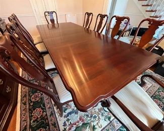 Seating for 10 with China cabinet, by Sumter Cabinet Company furniture. Table includes foldable fitted pad. Two removable leaves.