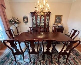 Seating for 10 with China cabinet, by Sumter Cabinet Company furniture. Table includes foldable fitted pad. Two removable leaves.