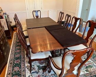 Seating for 10 with China cabinet, by Sumter Cabinet Company furniture. Table includes foldable fitted pad. Two removable leaves.
