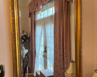 33 x 45 inches frame edge to frame edge. Gold leaf wood frame and beveled glass. 